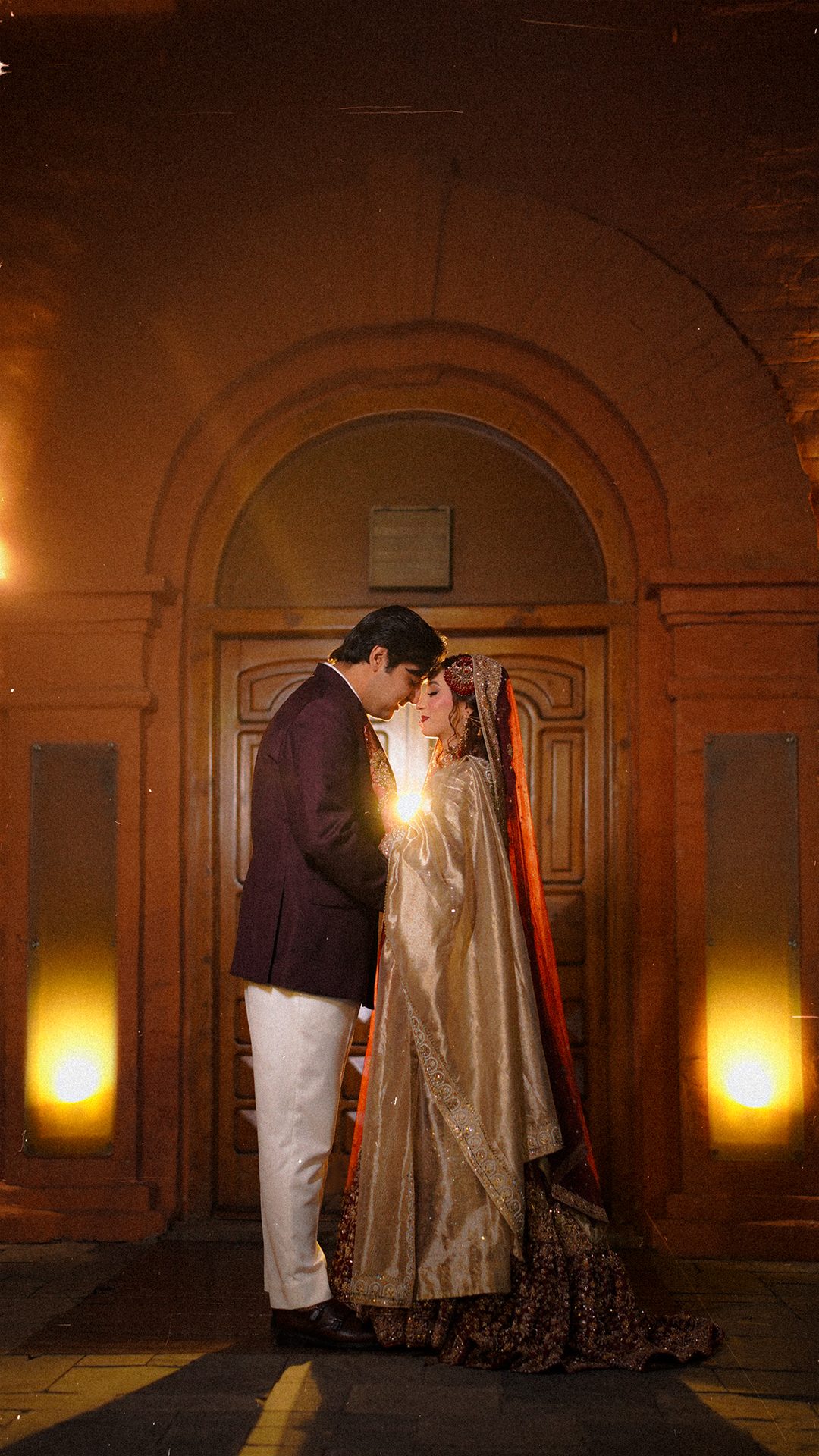 Couple beneath a carved arch
